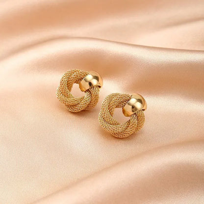 A pair of trendy stud earrings - Exquisite, minimalist, unique, and creative jewelry perfect for ladies to wear at parties.